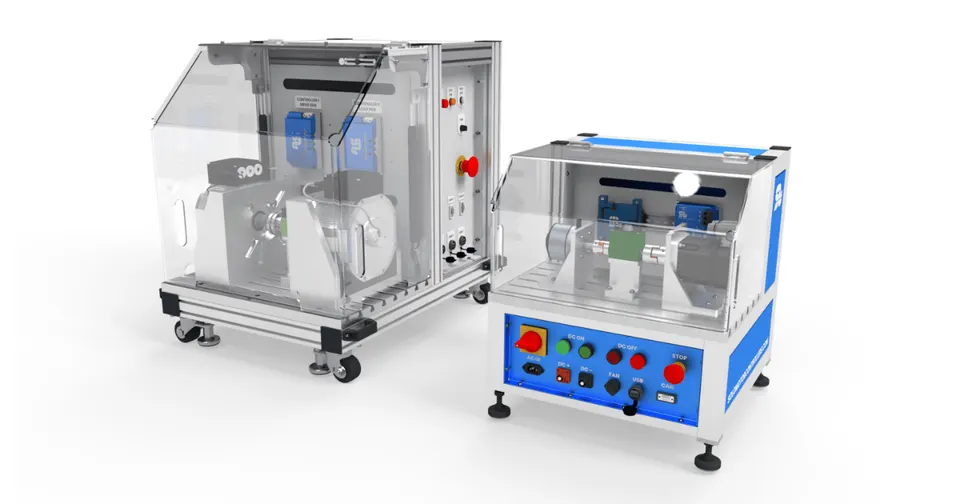 Two SOLO Motor Controllers test bench systems with protective transparent covers, control panels, and mounted motor fixtures for industrial and research motor testing applications.